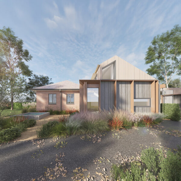 Timber-clad addition and brick dwelling, featuring a large glass entry and surrounding drought-tolerant planting.